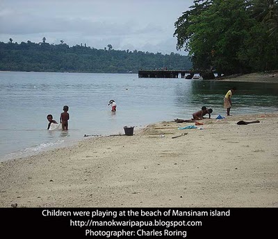 children were playing at the beach of Mansinam island