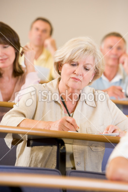 Student takes notes during lecture