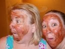 The author, being goofy with her daughter, donning chocolate face masks.....living in authenticity.