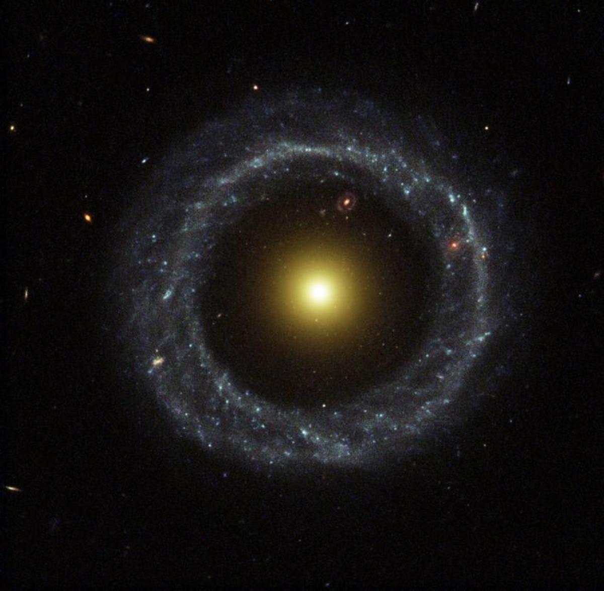 Ring of Hot Blue Stars Pinwheels Around Yellow Nucleus of Hoag's Object Galaxy