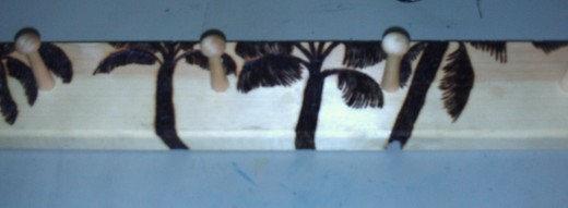 Here are Southern California palm trees that I wood burned on a jewelry rack.  I am quite happy with this piece.