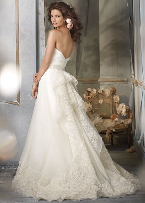 Jim Hjelm Bridal Gowns, Wedding Dresses: Style jh8002 Ivory Silk Organza A-line formal bridal gown, strapless draped bodice, natural waist with Ivory ribbon and floral detail, embroidered cascade back and hem, chapel train. Jim Hjelm Bridal Gowns, Wedding Dresses: Style jh8002 Ivory Silk Organza A-line formal bridal gown, strapless draped bodice, natural waist with Ivory ribbon and floral detail, embroidered cascade back and hem, chapel train.
