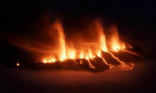 Volcanoes along plate techtonics boundaries often erupt in a chain of fire and lava, such as in Iceland, which straddles the mid Atlantic ridge.