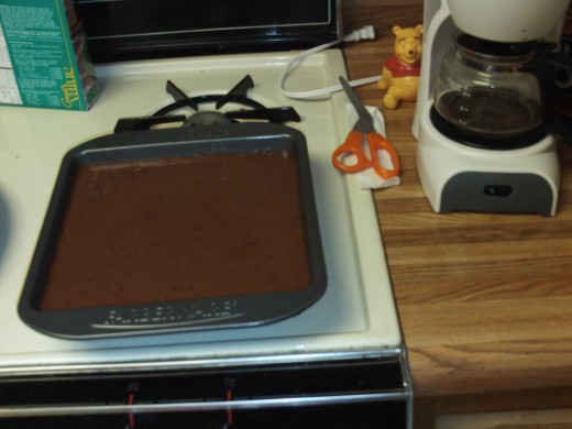 Pour cake mix into a baking pan.
