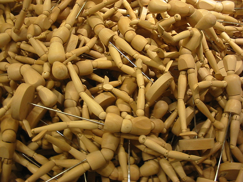 Buy wooden artists mannequins for figure drawing.    Image source - http://www.flickr.com/photos/elithebearded/3682150871/