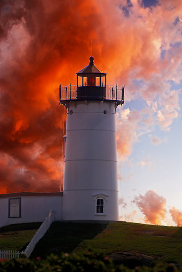 This red sky near a lighthouse can be a presage of a storm from the sea, especially on the east coast.