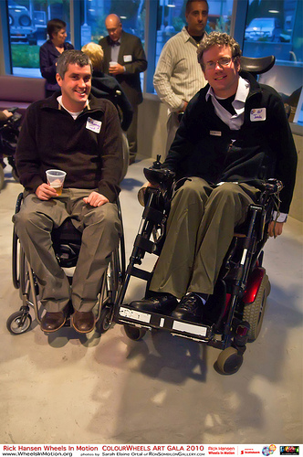 Men in manual wheelchair and power chair