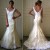 Wedding Dress:Alvina Valenta Bridal Gowns, Wedding Dresses: Style AV9863 Ivory silk duchess satin soft fluted bridal gown with tip of the shoulder delicate scoop neckline. Ivory silk organza overlay with white alencon appliqus throughout, covered but Wedding Dress:Alvina Valenta Bridal Gowns, Wedding Dresses: Style AV9863 Ivory silk duchess satin soft fluted bridal gown with tip of the shoulder delicate scoop neckline. Ivory silk organza overlay with white alencon appliqus throughout, covered but