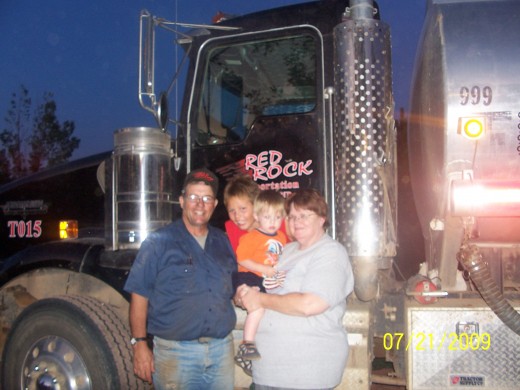 The driver, navigator and two of eight grandchildren.