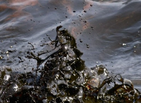 "Black waves of oil are seen off the side of the supply vessel Joe Griffin on May 9." From The Huffington Post. 