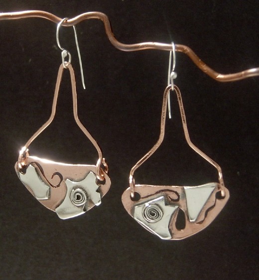 "Metal Play" Fabricated, cut and soldered earrings. 