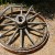 Old wagon wheel decorating the grounds Old wagon wheel decorating the grounds