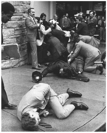 Timothy McCarthy in the foreground after shielding President Reagan with his body