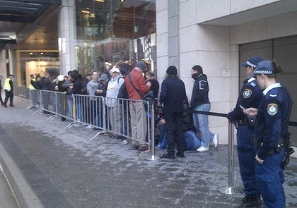 At 8am this morning, the doors flung open at Apple stores and eager customers poured in to buy the iPod maker's latest touchscreen gadget. Some, like Rahul Koduri, 22, first in line at Apple's George Street store in Sydney, waited patiently outside f