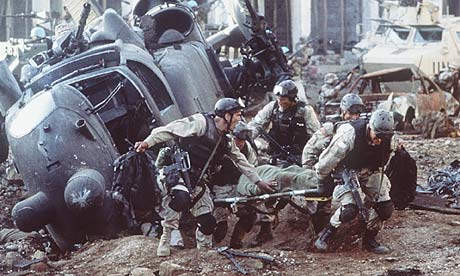 Delta Force evacuates wounded commrade to relative safety under fire.