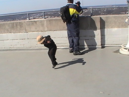 While Greg shot video from the top of Cincinnati's Carew Tower, Mom snapped a picture of two year old Daniel dancing with his shadow.  