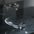 A elegant clear bathroom basin with wall mounted faucet. A clean bathroom sink basin could be visually clean and yet not be sanitized. A elegant clear bathroom basin with wall mounted faucet. A clean bathroom sink basin could be visually clean and yet not be sanitized.