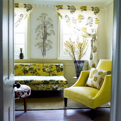 Different floral fabrics work together here because they have a common color palette, making this adorable retro-ish room look cohesive and serene.