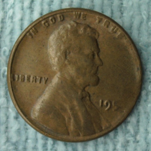 195? Lincoln Wheat Penny (Obverse)  The weight is 42 grains which is approximatly 6 grains to light.