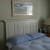 Old door as headboard with added molding. Old door as headboard with added molding.