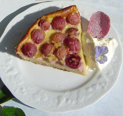 Sugared flowers make pretty decorations for this Clafouti.