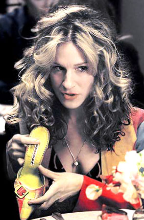 Carrie fondling her "other boyfriend", Manolo Blahnik