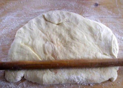 Use a rolling pin to make a thin crust.