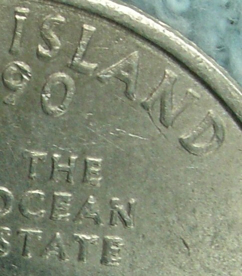 Closeup of the above coin with the areas of the most doubling.