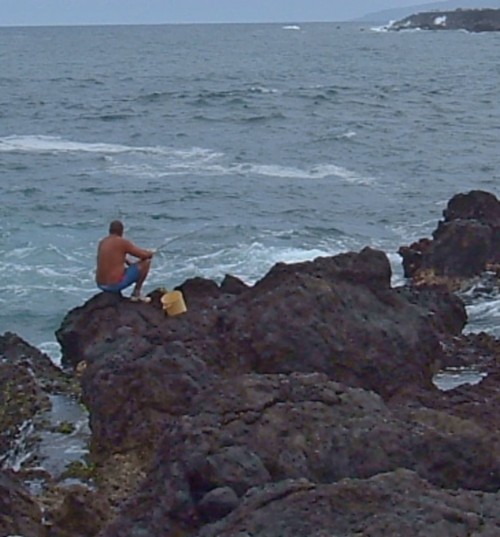 A fisherman on the Punta Brava rocks. Photo by Steve Andrews