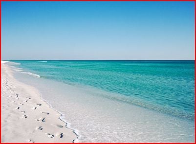 Pristine white sand and blue-green water -- lovely -- for now.