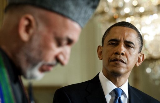President Barak Obama (right) listens as Afghanistan President Hamid Karzai speaks during a joint press conference at the White House in Washington, DC in May 2010. Karzai's government swung behind the embattled US commander in Afghanistan, warning t