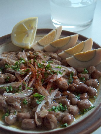 Ful Medammas -- mixture of horse beans and oil (olive) with ingredients and lime juice eaten in the morning