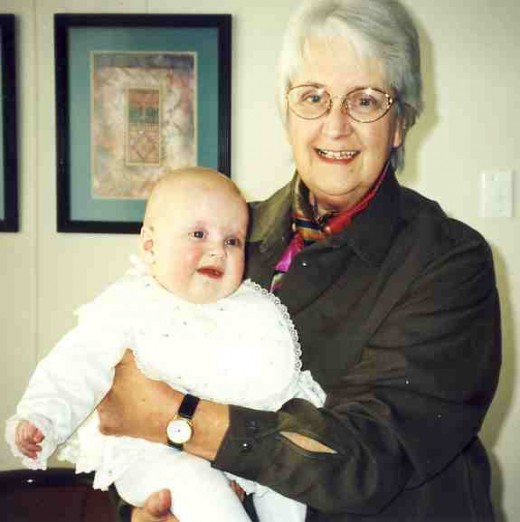 Esme Pollard holding Caitlin at the time of Caitlin's baptism in 2002