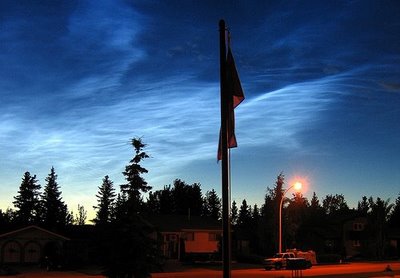 Just after sunset, or just before sunrise, you may see noctilucent or night shining clouds that are caused by solar radiation exciting hydrogen atom at the edge of space, typically at 80 to 100 kilometres up,