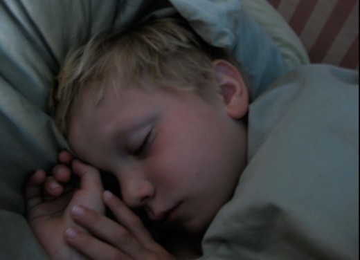 A child taking good night sleep after aromatherapy application.