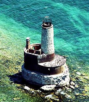 Aerial photo of the Waugoshance lighthouse marking the dangerous shoals in Lake Michigan off shore from Waugoshance Island in the Wilderness State Park