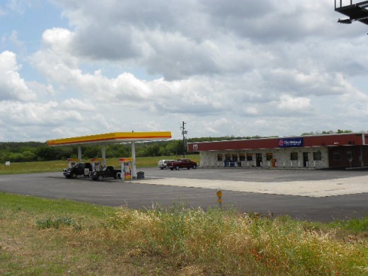 Shell Gas station with grocery and The National drive through bank    