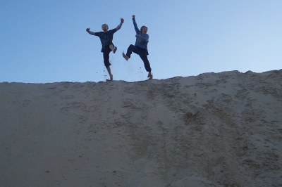My boys jumping around on a sand dune at Igoda beach near East London, South Africa, in June 2010
