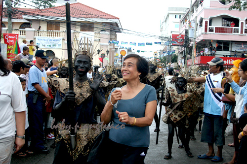 Dancing in the street together with black "colored" participants