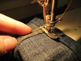 Machine sewing (especially with a professional-quality machine) will give you the most just-from-the-factory look, but this can be done by hand.