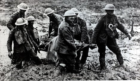 Soldiers helping the wounded at ypres, typical of the conditions!