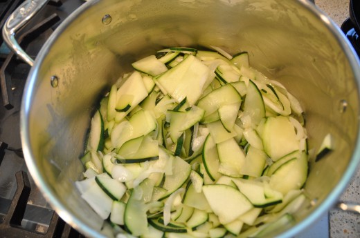 Slice zucchini and onion. Cook gently.