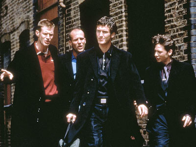 Jason Flemyng, Jason Statham, Nick Moran and Dexter Fletcher as four coniving friends in Lock Stock and Two Smoking Barrels. Jason Flemyng, Jason Statham, Nick Moran and Dexter Fletcher as four coniving friends in Lock Stock and Two Smoking Barrels.