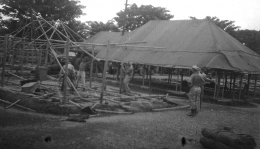 U.S. Army troops setting up camp in Philippine Islands during World War II