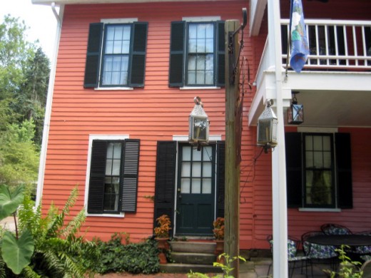 Room #9 is on the second floor (shades drawn). Darlene captured a spirit peeking out of the window on the first floor under the second floor deck.  The spirit is standing in the office/Register area--right where the photo of Bonnie (Blue Lady) Bounel