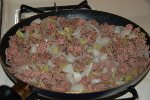  Meat, garlic, onions and banana peppers browned and ready for tomatoes.
