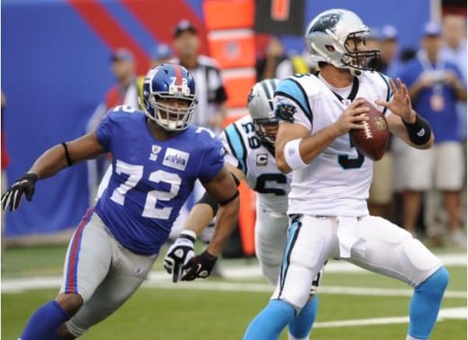 New York Giants defensive end Osi Umenyiora (72) tries to sack Carolina Panthers quarterback Matt Moore (3) during an NFL football game at New Meadowlands Stadium in East Rutherford, N.J., Sunday, Sept. 12, 2010. (AP Photo/Henny Ray Abrams)