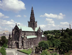 Glasgow Cathedral with the Necropolis graveyard on the hill in the background.