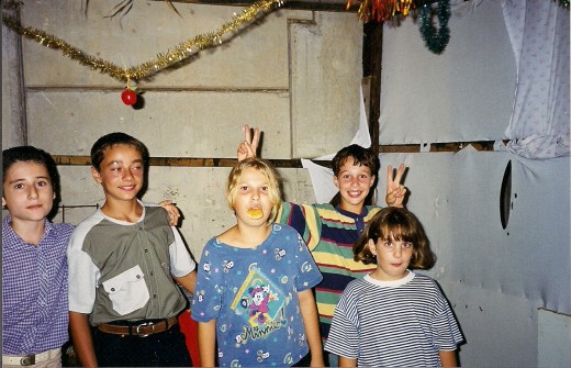 My son and his friends in their own Sukkah in the process of decorating it. 