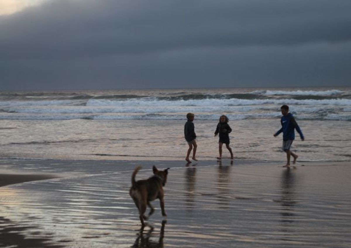 Garrett chases our kids on the Oregon Coast